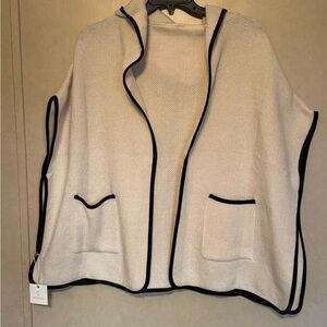Stylish Cream Poncho with Black Trim